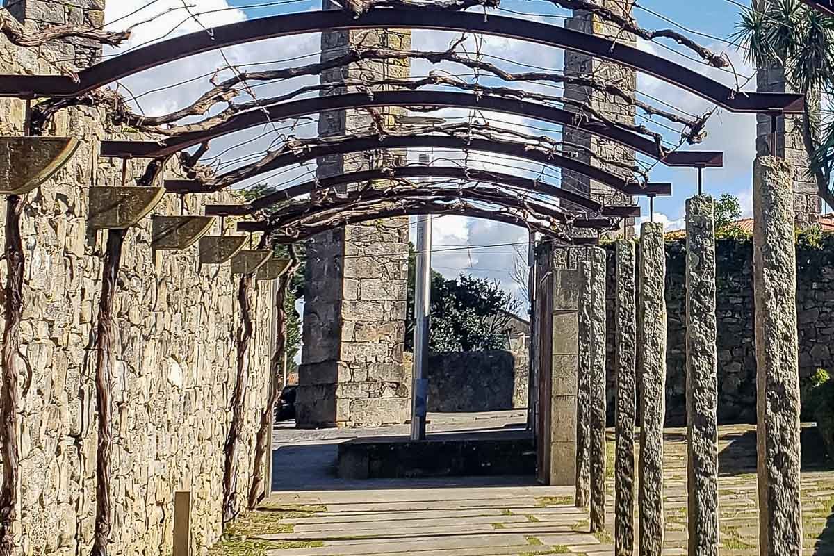 Found_15 Stone pergola colonnade with bare winter vines, receding perspective. In Vila do Conde.