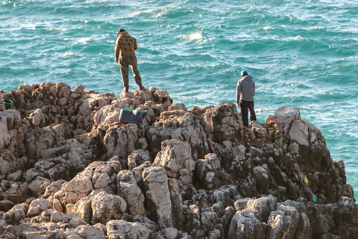 Found_2 Two figures on the rocks above the Atlantic. The sea has no interest in being reassuring.