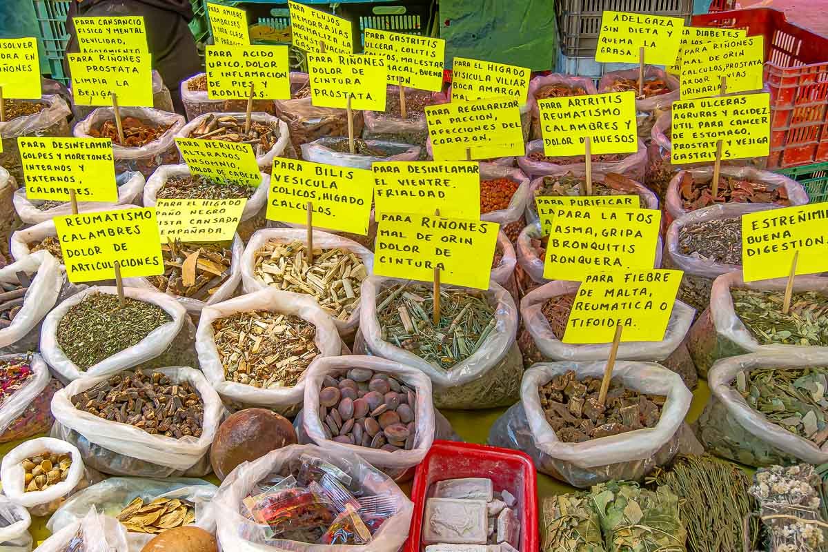 Markets_7 Rows of spice bins with hand-written yellow price tags, vivid reds, yellows, and greens