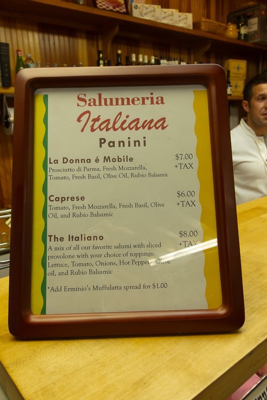 Signs_3 Handwritten Italian menu in a wooden frame on a bright yellow tablecloth