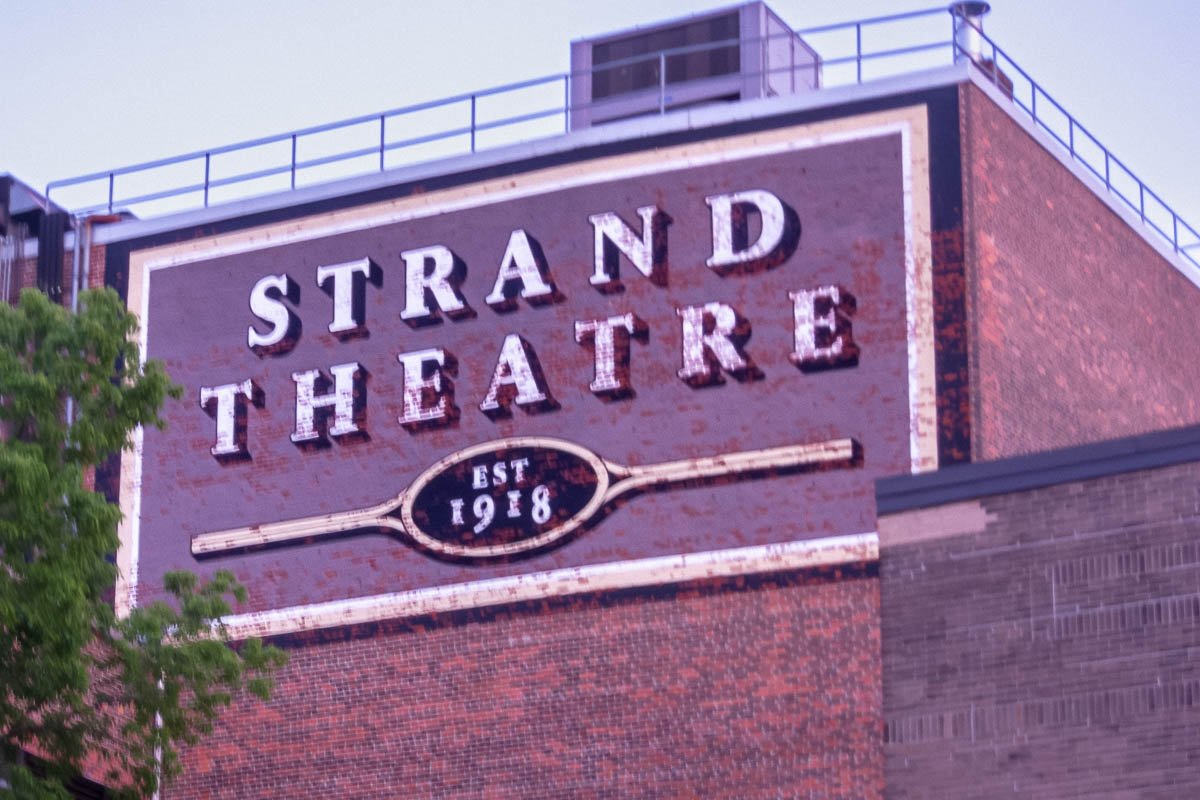 Signs_6 Classic brick cinema facade with STRAND