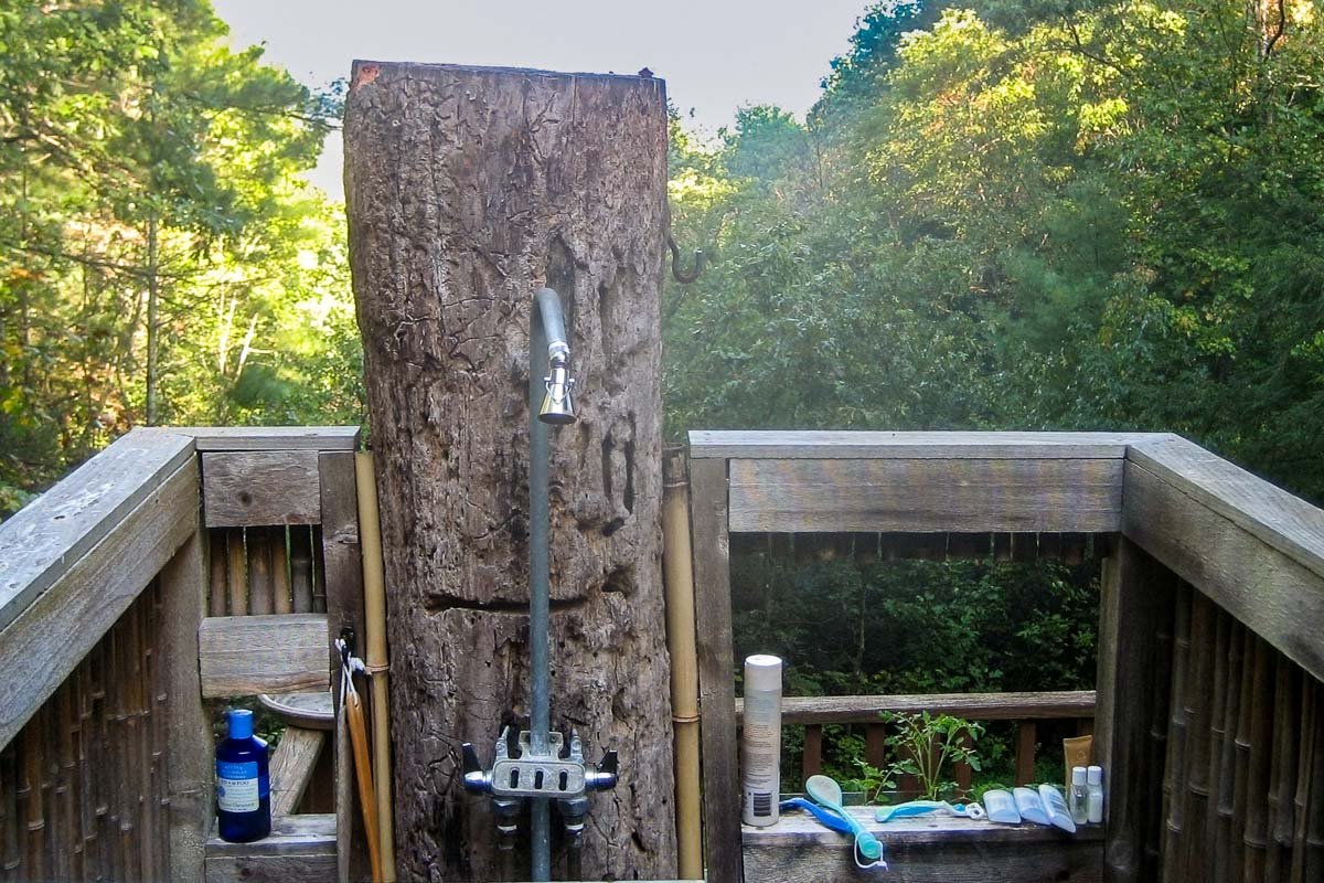 US_Housesit_15 Wooden outdoor shower surrounded by trees and garden, Morganton North Carolina