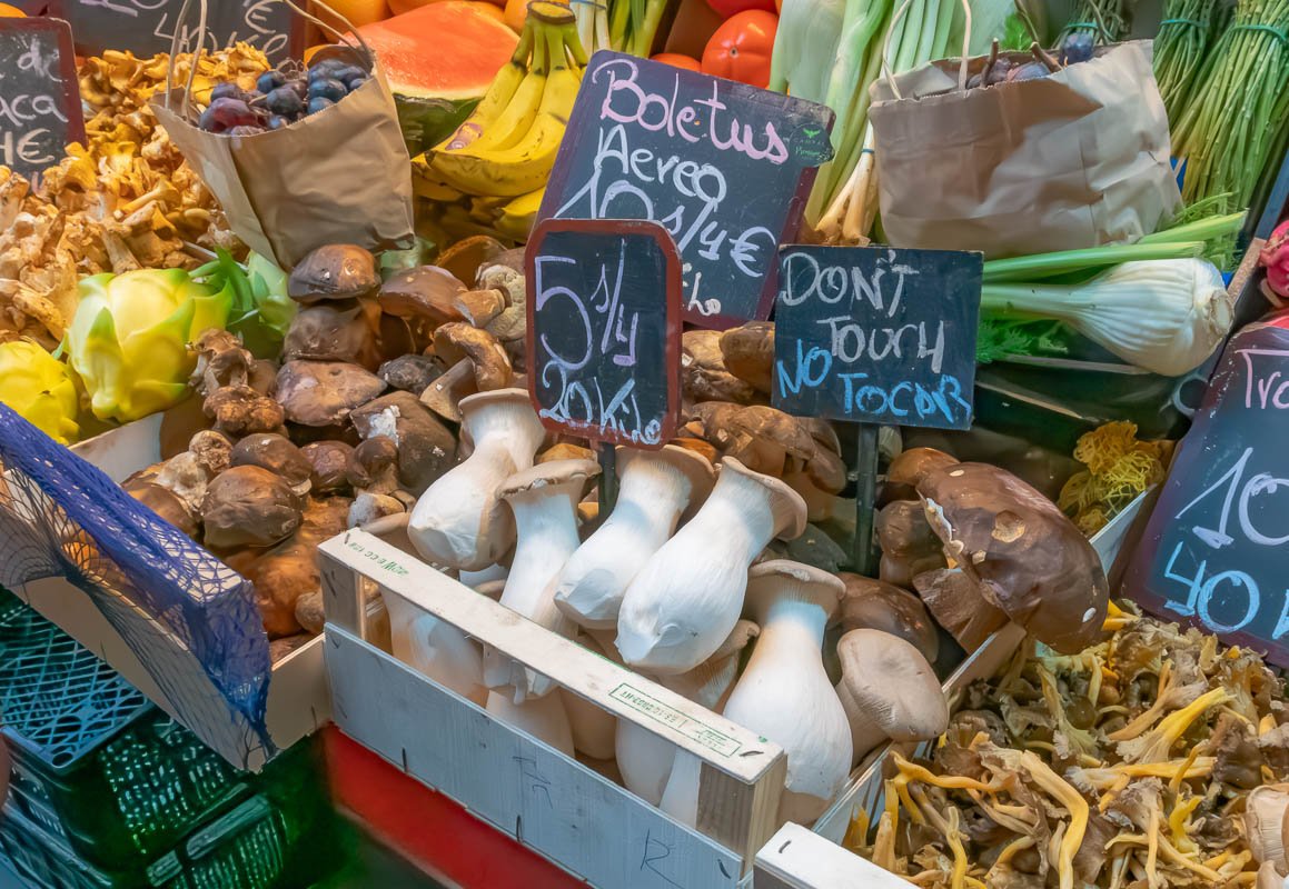 markets_11 Wooden crates of root vegetables and wild mushrooms with handwritten price signs