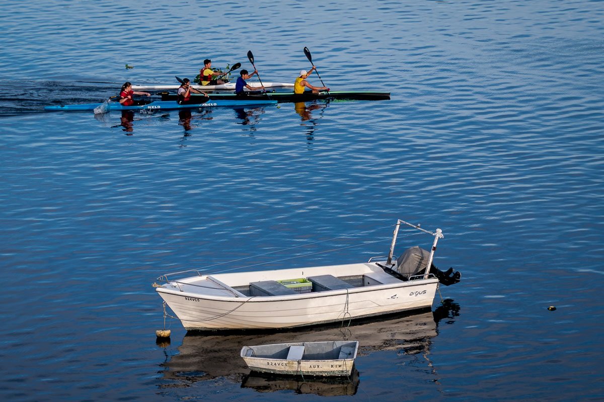 viladoconde4 Two moored boats with kayak team passing in background, Vila do Conde
